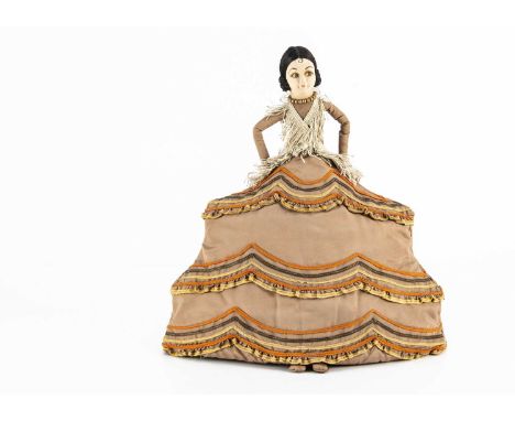 A Norah Wellings Spanish lady tea cosy,  with pressed felt swivel head, black silk cotton hair, felt hands on hips, light bro