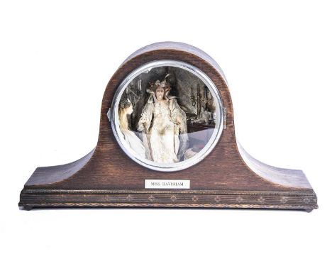 A Chapel Road Miniatures Miss Havisham room box in oak mantel clock, with figures of Miss Havisham and Estelle, electrically 