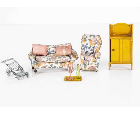 A Westacre dolls’ house sofa and armchair,  upholstered in floral print —4 1/2in. (11.5cm.) sofa wide (slight staining); a ye