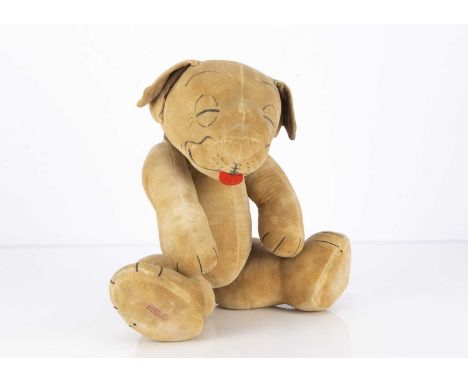 A large Chad Valley Bonzo the dog 1920s, of cream velvet, stencilled features, red felt tongue, swivel head, jointed limbs wi