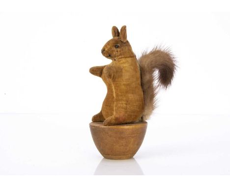 An early velvet squirrel skittle circa 1910, brown velvet, black boot button eyes, black stitched nose and mouth and turned w