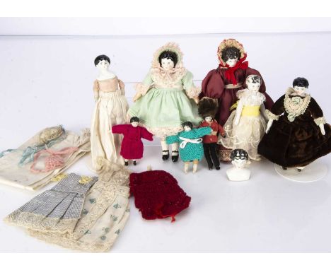 Large scale china shoulder head dolls’ house doll,  a doll with black painted moulded hair with two dresses, bonnet and other