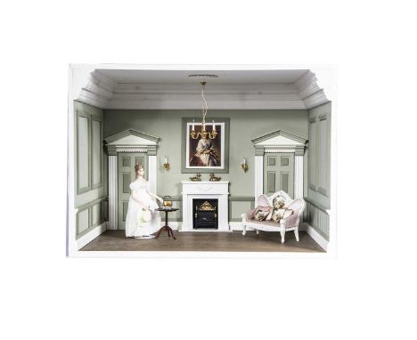 A modern miniaturist dolls’ house room box,  a Georgian panelled room with sofa, table with white metal basket and a Janet Ha