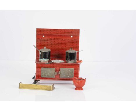 A Brimtoy lithographed tinplate large scale dolls’ house range cooker, with two ovens embossed with Brimtoy logo and two sauc