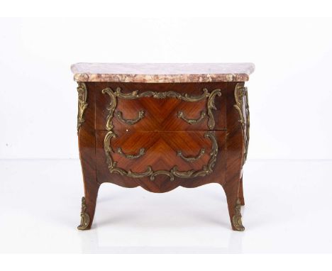 A 20th century replica of an 18th century French commode,  of kingwood with ormolu fittings and marbled top —10 1/2in. (27cm.