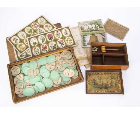 A late 19th century botanical lotto,  twelve cards with garden flowers, oval cards with common and botanical names of plants,