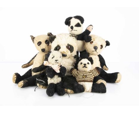 Six Panda Teddy Bears,  a 1930/40's Chiltern with remains of black and white mohair, orange and black glass eyes on black fel