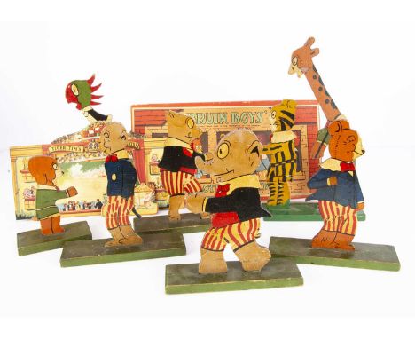 Eight Tiger Tim and the Bruin Boys two-dimensional painted wooden figures, on seven green panted bases —12 3/4in. (32.5cm.) h