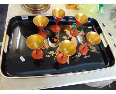 A paper mache tray and six cups