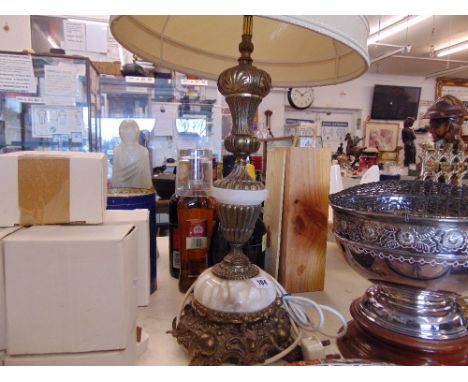 A large onyx and brass table lamp