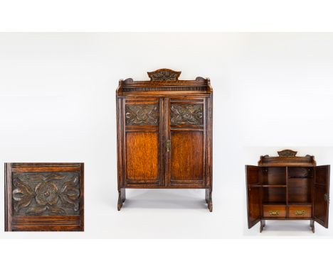 English - Early 20th Century Arts and Crafts Oak Cased - Free Standing Smokers Cabinet, with Decorative Carved Panel Doors wi