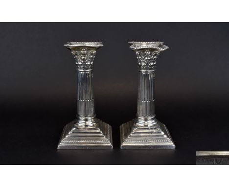 Edwardian Period Neoclassical Pair of Corinthian Column Silver Candlesticks, Raised on Square Shaped Stepped Bases. Hallmark 