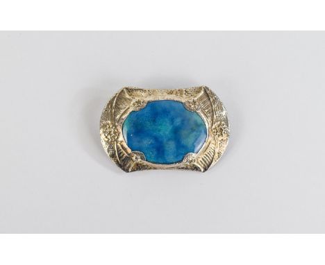 Ruskin Style Ceramic Brooch, a ceramic oval with mottled turquoise and blue glaze, probably by Ruskin, set in a white metal m
