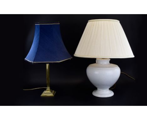 Two Table Lamps. One With White Bulbous Ceramic Base and Cream Shade, The Other With Gilt Column Base and Navy Blue Shade. 