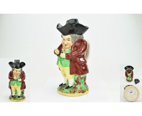 Staffordshire Early 19thC 'Snuff Taker' Toby Jug, the gentleman wearing a maroon coat, green waistcoat, yellow trousers and b