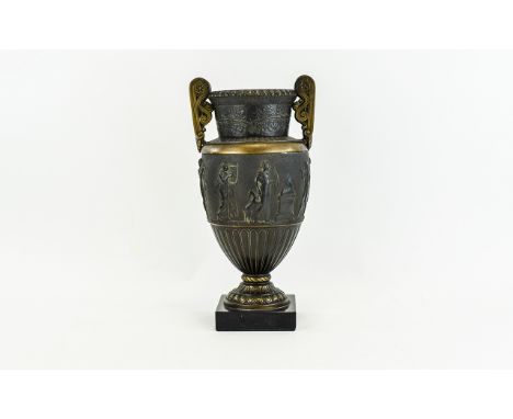 Bronzed Twin Handled Urn with classical scenes to central panel 14 inches in height.