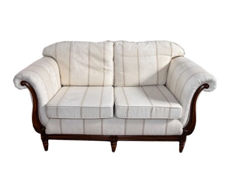 Two Seater Sofa Elegant two seater sofa with curved arms and carved scroll detail to arms and feet. Beautifully upholstered i