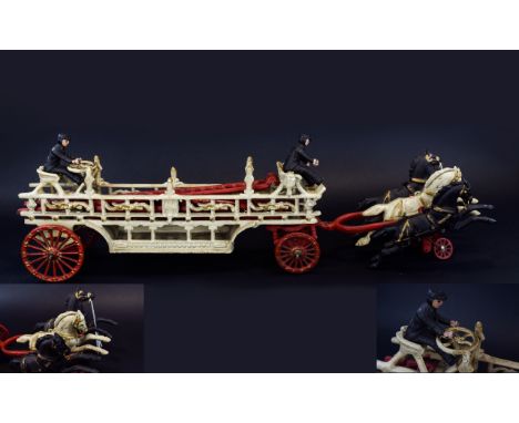 1930's Period Well Constructed Painted Cast Iron Horse Drawn Hook and Ladder Fire Wagon with Original Seated Drivers. 9 Inche