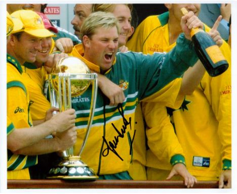 Cricket, Shane Warne signed 10x8 colour photograph pictured celebrating with the cricket World Cup. Warne born 13 September 1