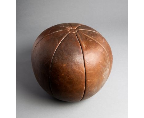 A 19th century leather gymnasium medicine ball,eight panels and button tops, diameter 30.5cm., weight 4.5kg