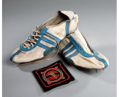 A vintage pair of Adidas athletics spikes circa 1960,white & light blue leather, the maker's label reading ADIDAS, THE MARK W