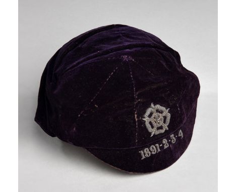 An early England international cap awarded to Johnny Holt of Everton for four successive appearances v Scotland between 1891 