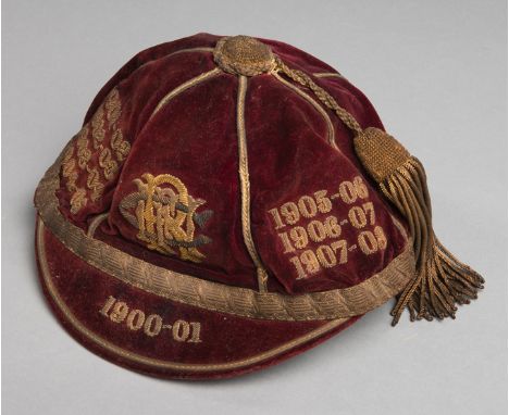 A Scottish rugby cap believed to be Melrose RFC and first awarded in 1900-01,the red cap by Tress & Co., London, but retailed