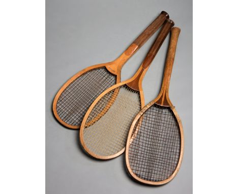 Three early 20th century wooden framed lawn tennis racquets,all with a convex head, the first a Slazenger fantail made for Cr