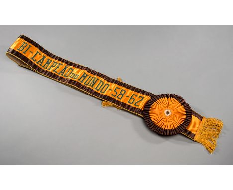 A fine Brazilian sash commemorating the country's two successive victories in the 1958 and 1962 World Cups,in orange & brown 