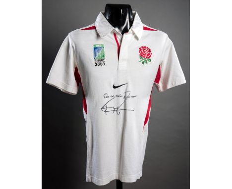 A Jonny Wilkinson signed England 2003 Rugby World Cup replica shirt,signed in black marker pen and inscribed TAKE CARE, MANY 