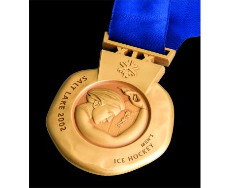 Salt Lake City 2002 Winter Olympic Games gold winner's prize medal awarded to a member of the Canadian men's ice hockey team,
