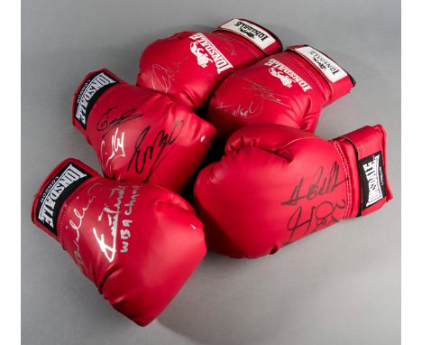 A group of five autographed red Lonsdale boxing gloves,bearing a total of 12 signatures including Ernie Terrell, Danny Willia