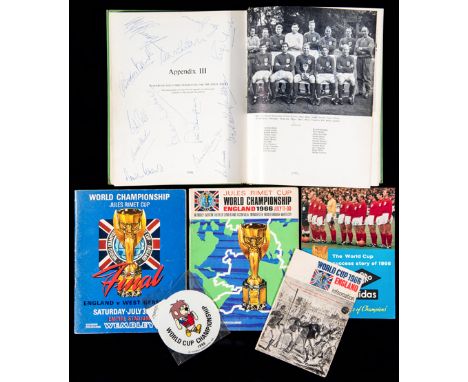 An autographed 1966 World Cup Official Report,signed on the Appendix III double-page by Ramsey, Banks, Hunt, Hunter, Peters, 