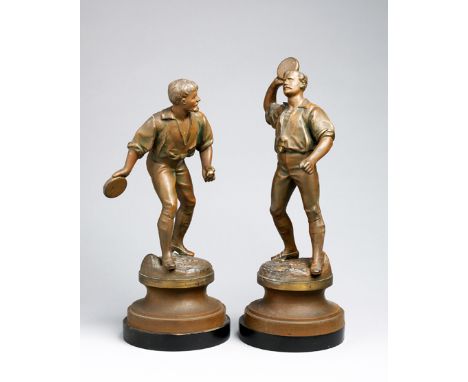 A pair of French 19th century spelter figures with the unusual sporting subject of jeu de balle au tambourin,one player about
