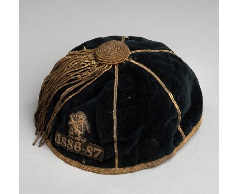 An early rugby cap dated 1886-87 believed to be for Swinton Rugby Club,the dark green cap with rampant lion crest and dated 1