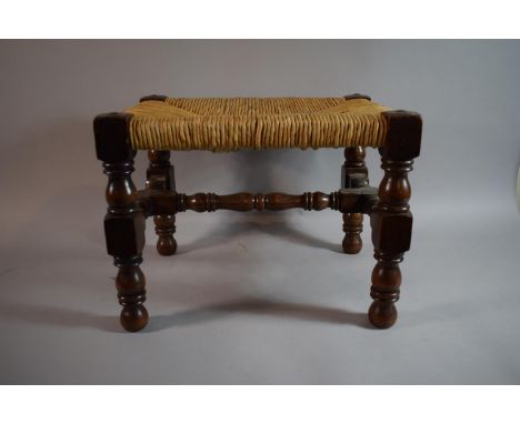A Rectangular Oak Topped Rush Topped Stool 