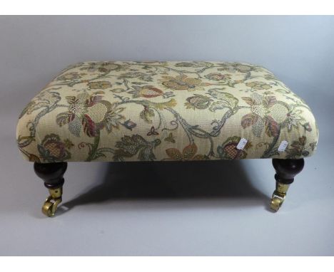 A Modern Rectangular Tapestry Topped Upholstered Stool with Turned Supports Culminating in Casters, 62cm x 41cm 