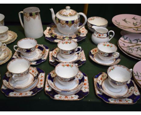 An Edwardian Part Tea Set Comprising Five Trios, Hot Water Jug, Cup and Saucer, Teapot (Spout AF), Cream and Sugar etc 