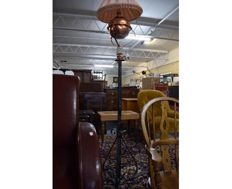 A Wrought Iron Based Tripod Lamp Stand with Upper Copper Lamp Holder and Oil Lamp Converted to Electricity 