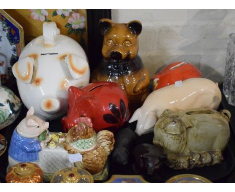 A Collection of Ceramic Pig Money Boxes, Butter Dish and Two Resin Ornaments 