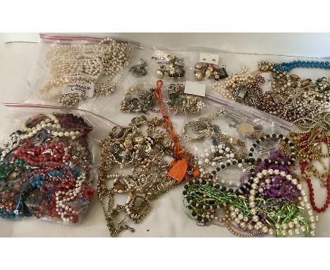 A large quantity of vintage costume jewellery to include necklaces, bracelets and earrings. 