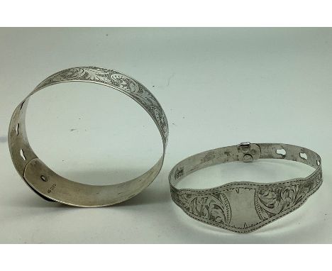 Two Chester hallmarked silver bangles, 1921/1927, one by Charles Horner. 34.7gms. 