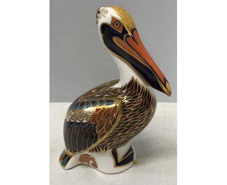 A Royal Crown Derby paperweight in the form of a brown pelican with silver stopper. 12.5cms h. 