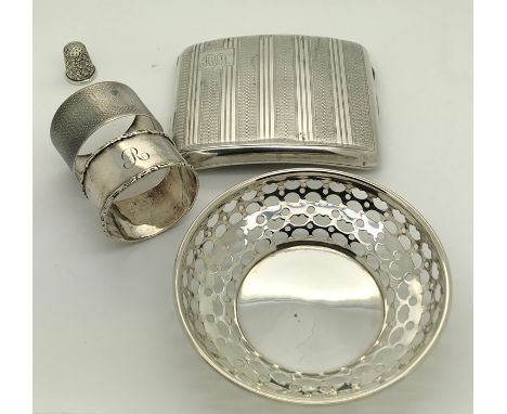 Silver to include a cigarette case with engine turned decoration, two napkin rings, inscribed 'David' and 'R' a pierced dish 