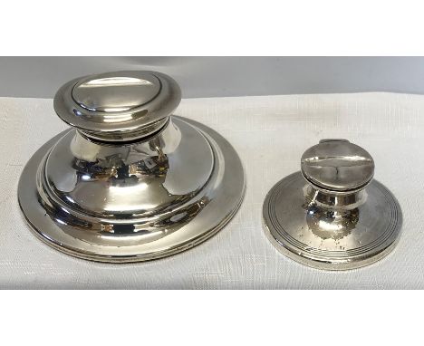 Two silver Capstan inkwells, larger, Birmingham 1920, 14cms d. Condition ReportSlight crack to lid on smaller.