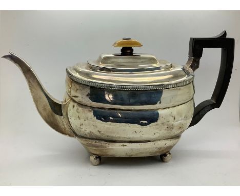 A silver teapot with ebony handle and ivory knop, London 1811, possibly Thomas Hayter, 590gms approx. 