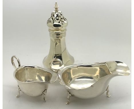 A silver sugar Birmingham 1927 caster together with two silver jugs. 288.2gms.Condition ReportOne with splits and the other w