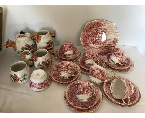 A Keele pottery hunting themed tea set comprising teapot, sugar bowl, and 3 jugs all good condition together with a Sutherlan