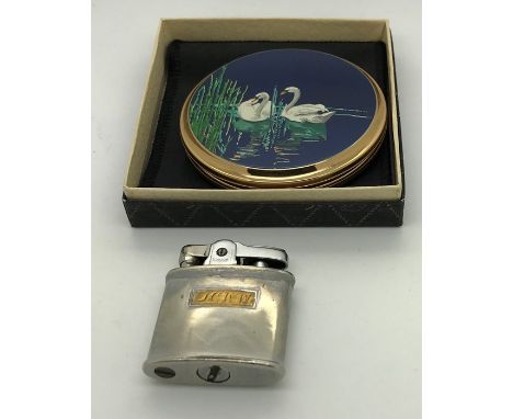 An unused Stratton lighter in orignal box with swan decoration together with a Ronson lighter. Condition ReportMirror slight 