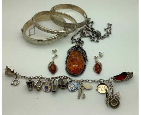 Jewellery to include amber pendant and earrings marked .925, 2 silver hallmarked bangles, 1 unmarked white metal bangle and a